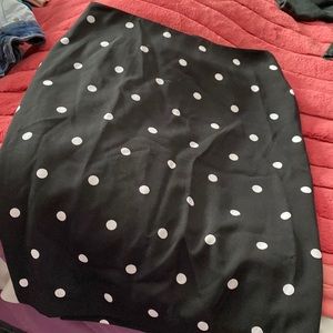 Black skirt with white Poke a dots goes to knee length